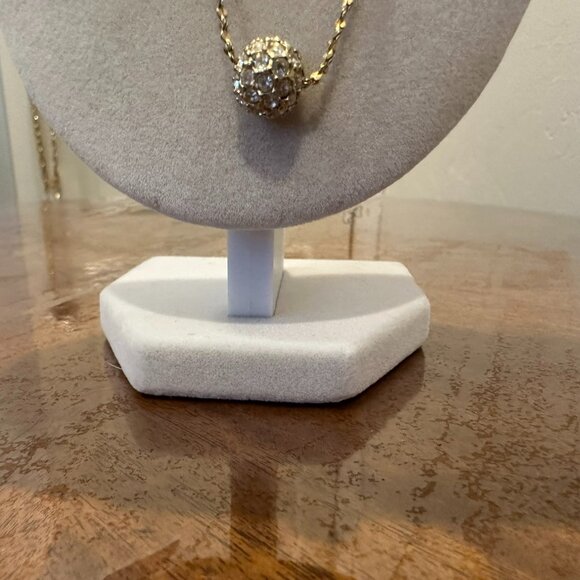 This necklace is a gold-tone with a rhinestone ball pendant. - Picture 2 of 7